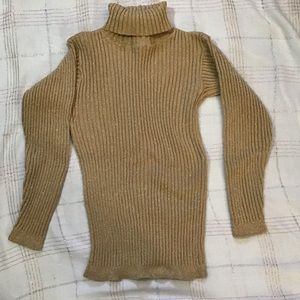 Attractive gold turtleneck sweater
